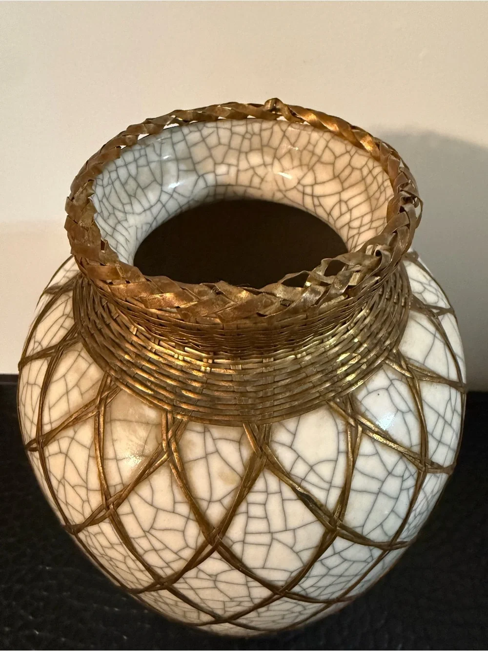 Japanese pottery vase craquelure glaze and a basketweave metal overlay.